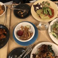 Butternut squash bowl, enchiladas, Caesar salad, pesto kelp noodles, Buffalo cauliflower and coconut calamari.  I love being vegan!!  at Cafe Gratitude in Venice