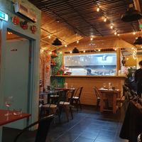 View of kitchen from dining room at Machan Kitchen in London