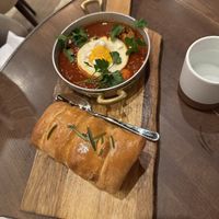 Off the specials brunch menu - spicy something with fried egg and fresh bread    at Anixi in New York City
