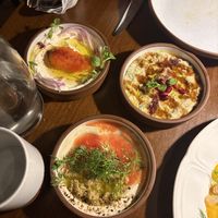 Trio of dipping mezzes: yogurt with caviar, olive tahini, and aubergine  at Anixi in New York City
