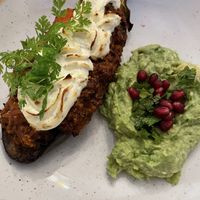 Baklazhan, rosted aucergine with quinoa ragu and almond rosted cheese. Avocado and mint mash with pome granate  at Restaurant Pasternak in Berlin