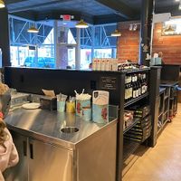 Self-service station for cutlery, paper plates, take home boxes  at Boom's Pizza in Lakewood