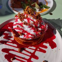 Pancakes with sour cherry red beets sauce, cream and amaranth crocant at Blumental in Berlin