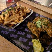 Wings with jalapeno sauce and cheesy fries at LD's Kitchen - The Black Heart in North West London
