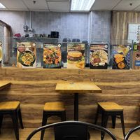 Signs near the prep area and tables   at Seva Cafe in Central Singapore