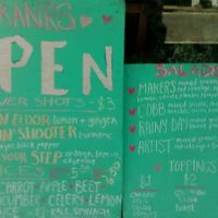 The portion of the Sissy's outdoor menu boards showing drinks (left) and salads (right). Picture taken March 2021. at Sissy's Cafe in Kingston