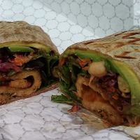 Haven's Wrap is a vegan choice at Sissy's, with garbanzo beans, tempeh, sunflower seeds, carrots, red cabbage, and  more, along with  tahini. Seen in foil wrapping. June 2021. at Sissy's Cafe in Kingston