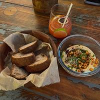 Hummus, confit garlic, sourdough bread  at Madhouse in Budapest