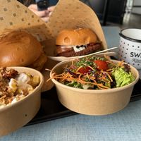 Vienna burger,  bacon burger. Garlic fries. No plastic, love it!  at Swing Kitchen in Munich