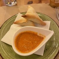 Vegan samosas with a tomato & peanut saucee  at Zigni Ristorante Eritreo in Verona