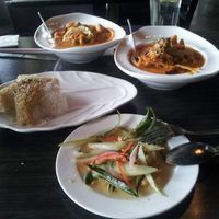 Pumpkin curry, spicy noodles, brown+white rice, summer salad at Plumeria in San Diego