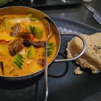Pumpkin Red Curry with vegan duck and brown rice. at Plumeria in San Diego
