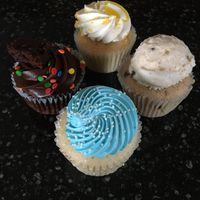 Clockwise from the left: Cosmic Brownie, Lemon, Cookie Dough, Lemon Blueberry at Vegan East - 34th Ave S in Minneapolis