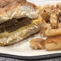 sausage egg & cheese + home fries   at The Local's Spot in Egg Harbor