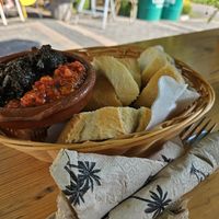 Greeting from the kitchen with tomato salsa & olive tapenade at Bagatelle Bistro im Palmengarten in Cologne