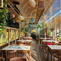 Part of the seating area inside at Bagatelle Bistro im Palmengarten in Cologne