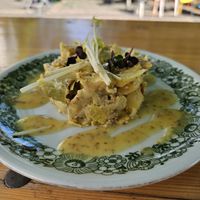 Artichoke and potato tartar in mustard vinaigrette with pea sprouts at Bagatelle Bistro im Palmengarten in Cologne