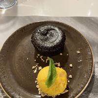 Vegan chocolate cake with mango ice cream  at UDON - Viapol in Sevilla