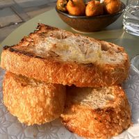 Sourdough, with Stuffed Padron Peppers lurking in the background  at Palmito in Hove