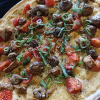 Veganer Flammkuchen mit Seitan at LUCKY in Moenchengladbach