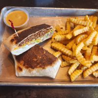 Crunch wrap and fries at Vegan Vibrationz in Plano