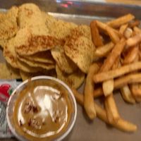 Chips and queso with fries    at Vegan Vibrationz in Plano
