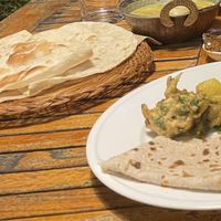 Roti, yellow lentil dal with tomatoes , Pakora (fried veggie fritter)  at Sitar Indian & Thai in Sigatoka
