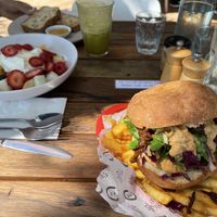 The fruit salad in photo is not vegan.  The onion Bhaji burger with chips is vegan and is to die for.  Really good food.  I also had a chai with almond milk, also very good.  at 5 Little Pigs in Huskisson