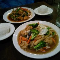 Tofu and veggies with light garlic sauce in the front, tofu with basil leaves in the back.  at Bua Thai Cuisine in Washington