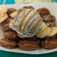 chocolate pancakes with fresh banana, peanut butter drizzle, and cookies and cream whip at Tree Popoki Cakes in Kailua