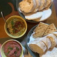 Eggplant dip and (garlicky) beet hummus with bread basket  at Gira Sol in Tomar