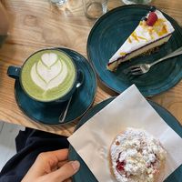 Matcha latte with pea milk, cheesecake and a bun  at Kawastrofa in Wroclaw