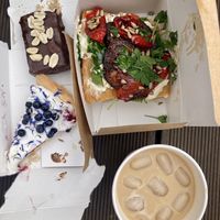 Best ever sneakers like cake with chokolate and soft caramel. Blueberry pie. Foccasia. Iced coffe with caramel syrup.   at Kawastrofa in Wroclaw