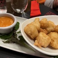 Crispy cauli bites dipped in almond milk and a light flour batter with Sriracha and coconut dip   at Red Torch Ginger in Dublin