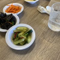 Avocado Rolls, Sides Pictured: Pickled Cucumber, Wood Ear Mushrooms, Shredded Carrots w/Cilantro, Seaweed Salad (not in frame), and Shredded Potato Salad.  at Happiness Cafe in San Jose