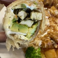 Avocado Roll - Roti, Cabbage, Vegan Chick’n’ Strips, Fresh Avocado, Carrots. 😋  at Happiness Cafe in San Jose