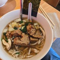 Vegan bowl with udon, vegetable broth, and seitan at Yum Yum Noodle Bar in Woodstock