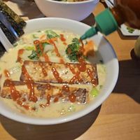 Vegan noodle bowl with coconut curry, udan noodles, tofu, extra veg at Yum Yum Noodle Bar in Woodstock