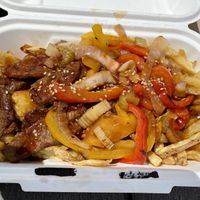 Fries topped with Korean bbq “steak" stir fry  at Kate's Food Truck in Jericho