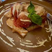 Olive meatballs on polenta at don Fred in Newtown