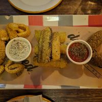 Calamari: subtle seafood smell, great taste, very crispy, good sauce; Zucchini fritte: moist inside, crispy outside; Suppli: similar to arancini, little bland, good sauce at don Fred in Newtown