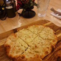 Garlic and Rosemary bread with vegan cheese at La Dolce Tavola in Rugby