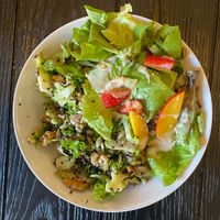 Two absolutely delicious salads on one plate. 1) kale and broccoli 2) unsure of name — contained fruits, nuts and greens and was finished with a tahini dressing. at Simply Son Braho in Mallorca