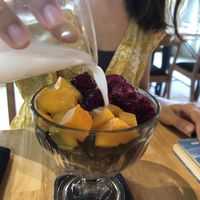 Granola bowl with Mango, dragon fruit and coconut milk at Living Food Lab Canggu in Canggu