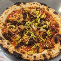 Sausage pizza with extra light cheese and chili flakes at White Labs Brewing Co in Asheville