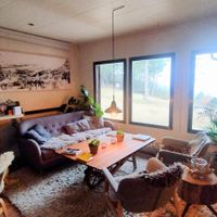 Main area with a bar at Minds & Mountains Eco Lodge in La Molina