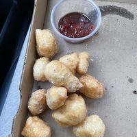 I forgot what these were called but they were like funnel cake balls. So addicting!  at Mora Pizza Denver in Denver