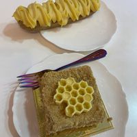 Passion fruit eclair and honey cake  at Cream Dream - Covent Garden in London