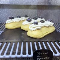 Vegan eclair with cream, whipped cream and blueberries at Letters and Numbers in Yerevan