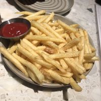 Planta burger -no lettuce, no tomato, no mustard, no queso, no pickle , no mayo, just onion (served with fries, not salad) 
  at PLANTA in Brooklyn